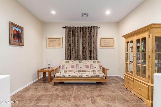 sitting room featuring tile patterned floors