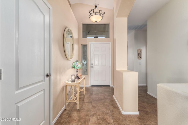 tiled entrance foyer with lofted ceiling