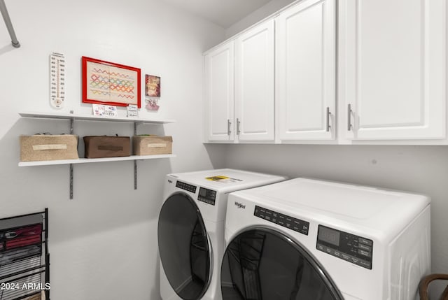 laundry area with washer and dryer and cabinet space