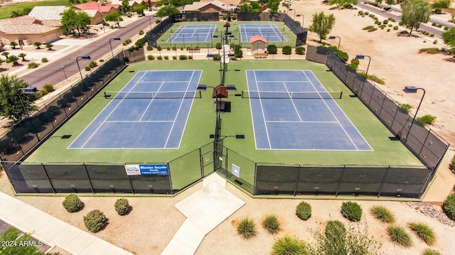 view of sport court with fence