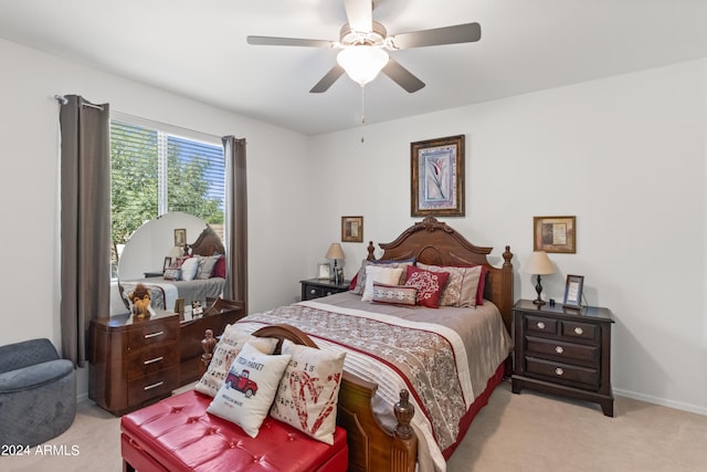 bedroom with ceiling fan and light carpet