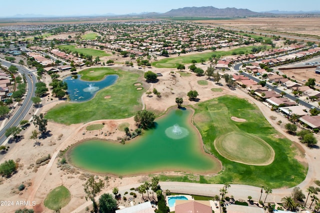 aerial view featuring a residential view, golf course view, and a water and mountain view