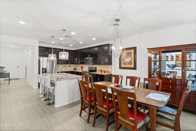 sitting room featuring ceiling fan and light hardwood / wood-style floors