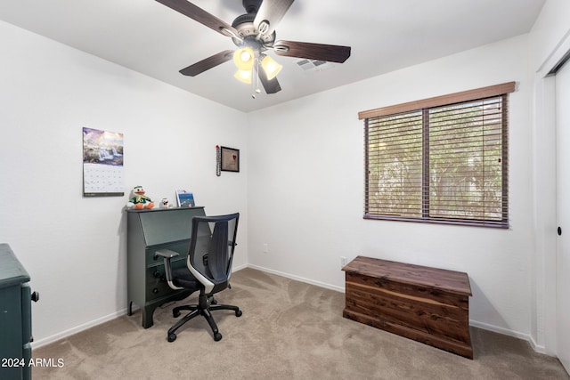 office space with light colored carpet and ceiling fan