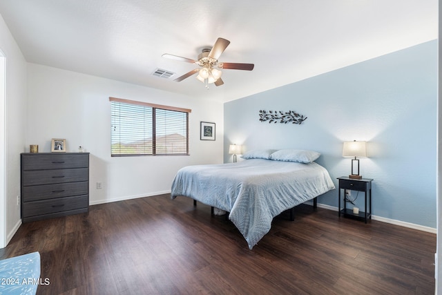 bedroom featuring dark hardwood / wood-style flooring and ceiling fan