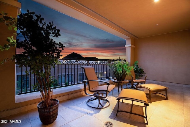 view of balcony at dusk