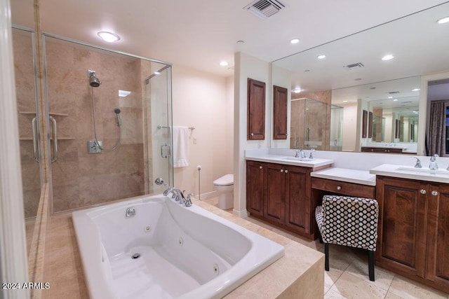 full bathroom with toilet, tile patterned floors, vanity, and separate shower and tub