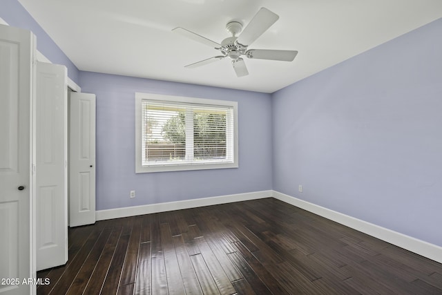 unfurnished bedroom with ceiling fan, baseboards, and wood finished floors