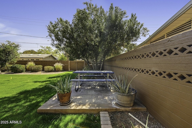 view of yard featuring a patio area and fence