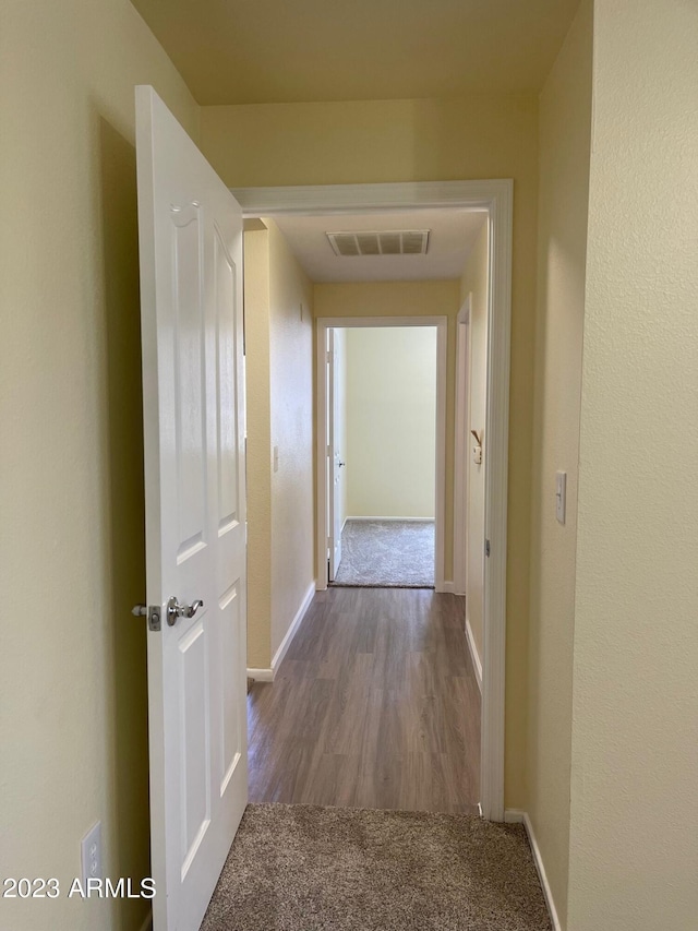 hallway with light wood-type flooring