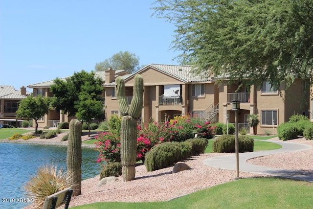 view of home's community featuring a water view