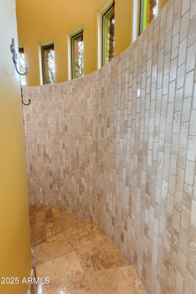 bathroom with stone tile floors