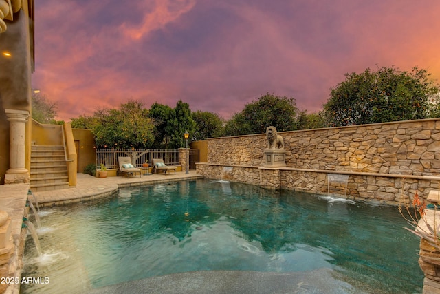 view of swimming pool with stairs, a patio, fence, and a fenced in pool