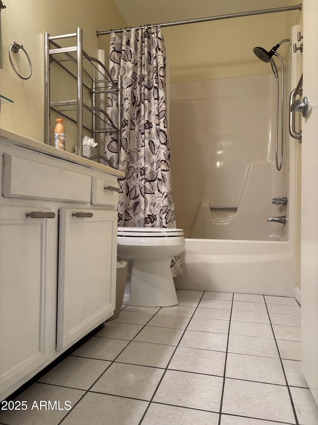 bathroom with toilet, shower / tub combo, vanity, and tile patterned floors