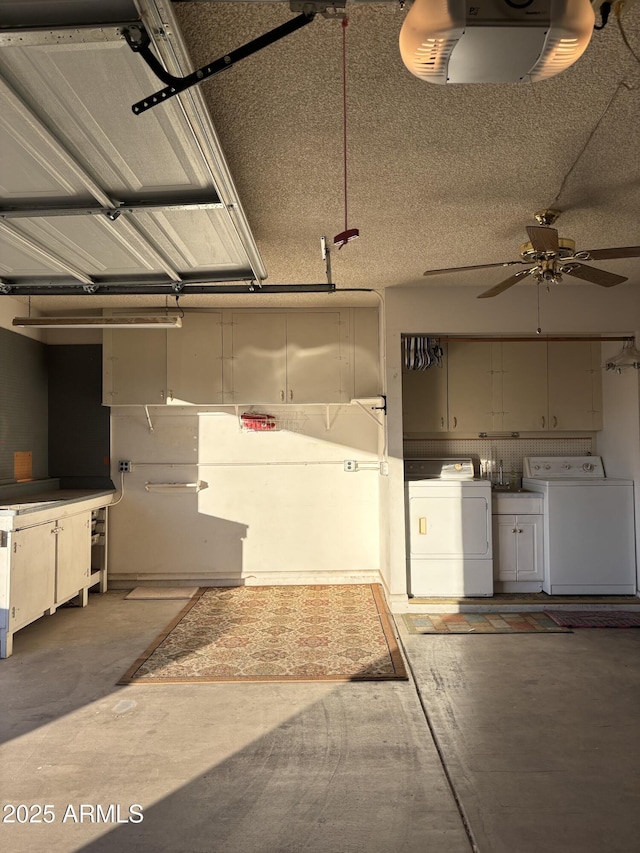 garage featuring ceiling fan, washer and clothes dryer, and a garage door opener