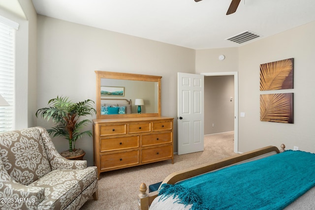 bedroom featuring ceiling fan and light colored carpet