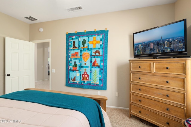 bedroom with light colored carpet