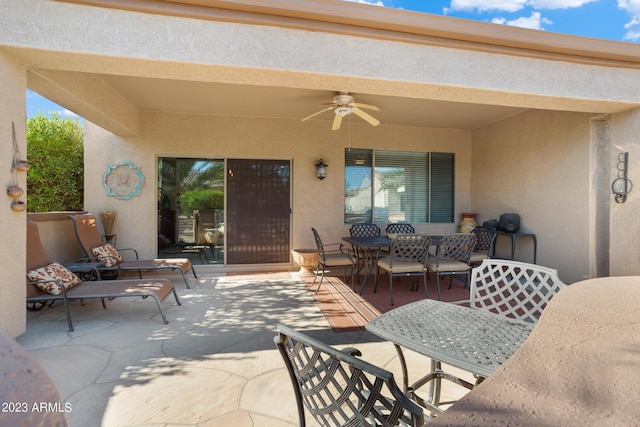 view of patio featuring ceiling fan