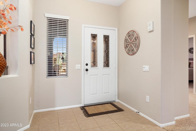 entryway featuring light tile patterned floors