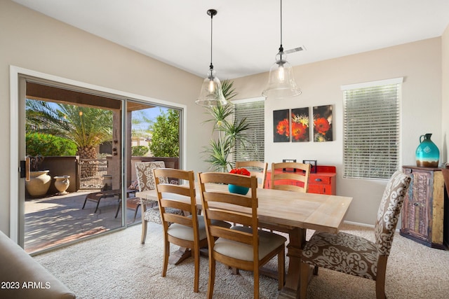 view of carpeted dining area