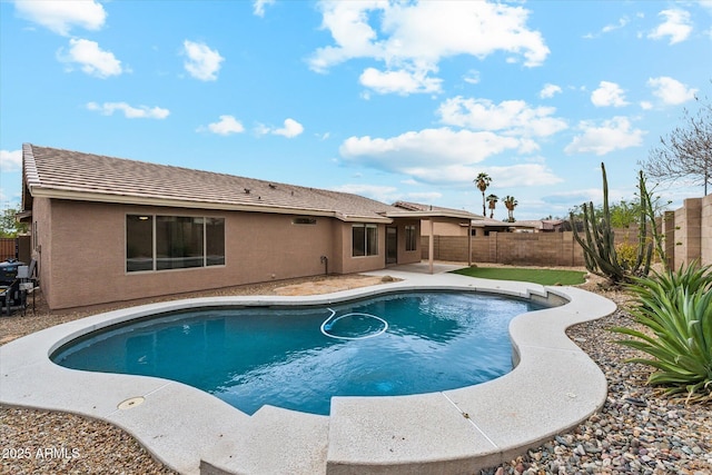 view of swimming pool featuring a patio area, a fenced backyard, and a fenced in pool