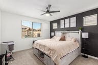 bedroom featuring light colored carpet