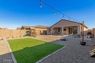 back of property with a playground, a lawn, a patio area, and a fenced backyard