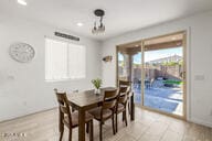 dining space featuring light wood-style floors