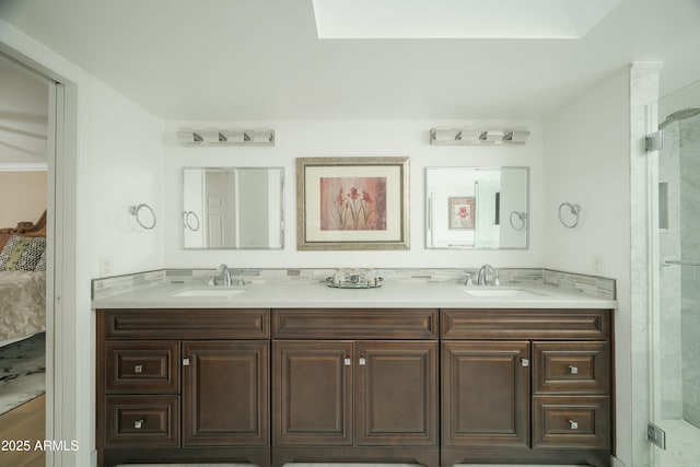 bathroom featuring double vanity, ensuite bath, and a sink