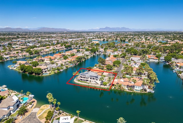 birds eye view of property featuring a water and mountain view