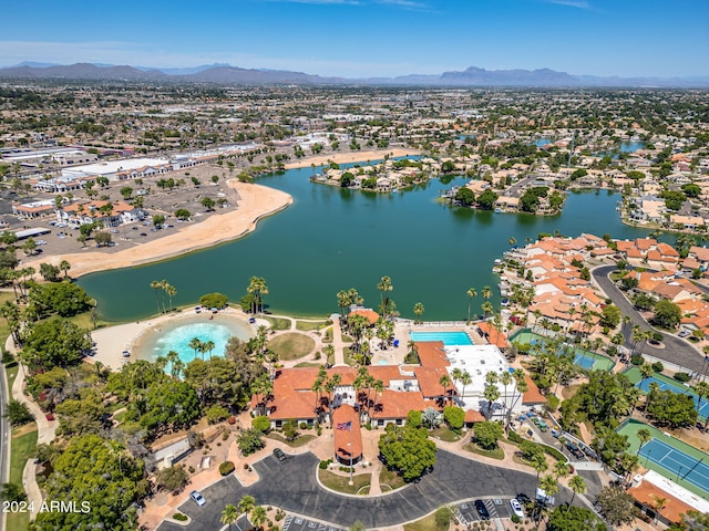 drone / aerial view featuring a water and mountain view