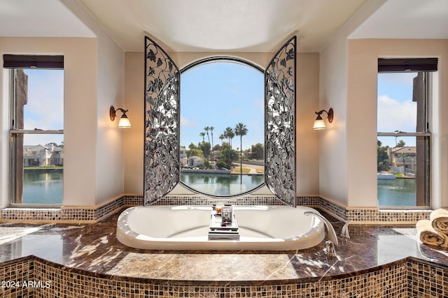 bathroom with a water view