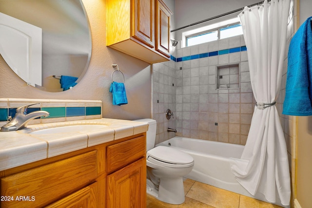 full bathroom with toilet, vanity, tile patterned floors, and shower / tub combo with curtain