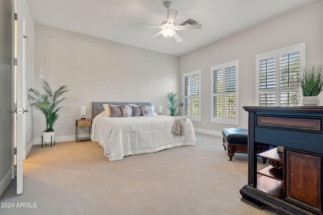 carpeted bedroom with ceiling fan