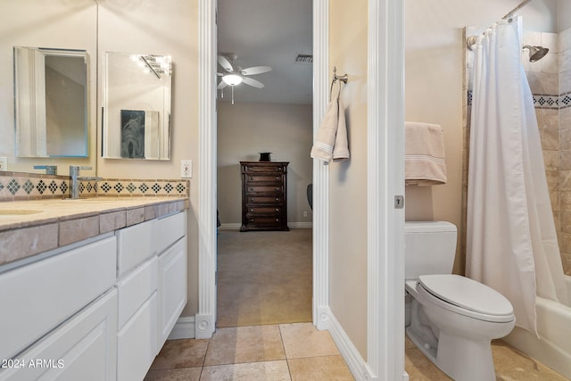 full bathroom with backsplash, vanity, ceiling fan, shower / bath combo with shower curtain, and toilet