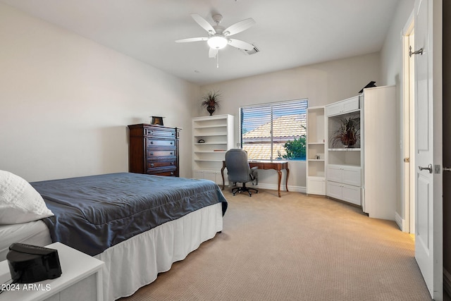 bedroom with ceiling fan and light carpet