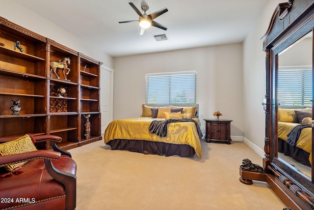 carpeted bedroom with ceiling fan