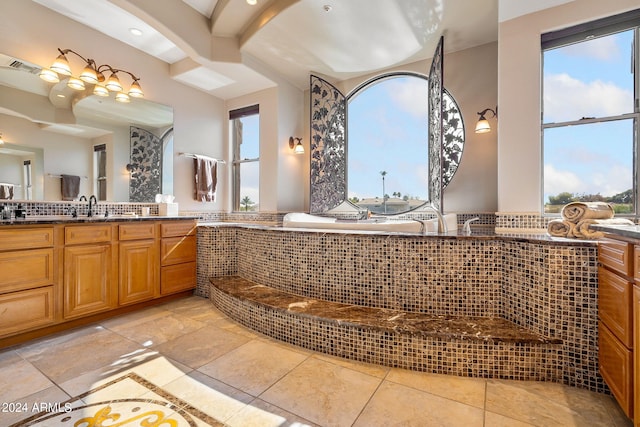 bathroom with vanity, plenty of natural light, and beamed ceiling