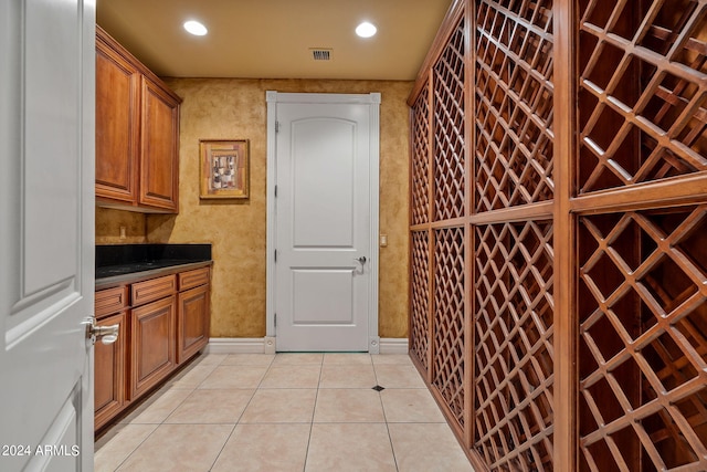 wine area with light tile patterned floors