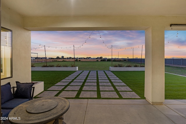 patio terrace at dusk with a lawn