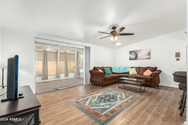 living room featuring hardwood / wood-style flooring and ceiling fan