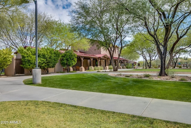 view of home's community featuring a lawn