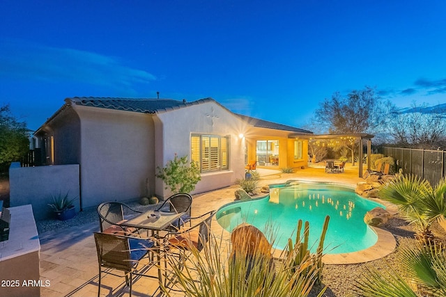 view of swimming pool with a patio area, fence, and a fenced in pool