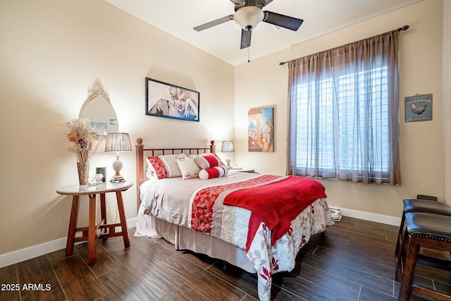 bedroom with ceiling fan, baseboards, and wood finished floors