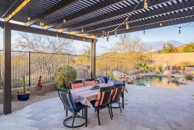 view of patio featuring outdoor dining space, a fenced backyard, and a pergola