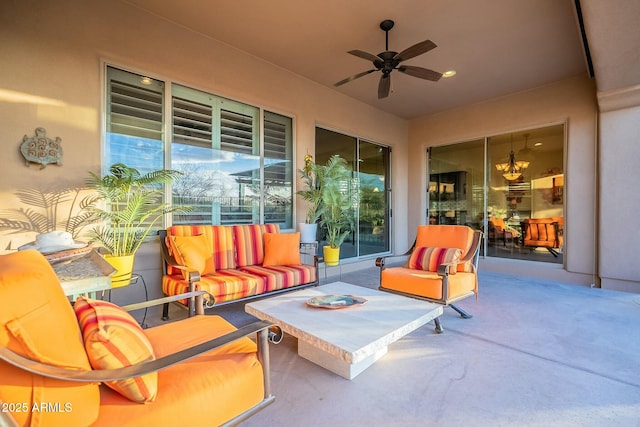 view of patio with ceiling fan and an outdoor living space