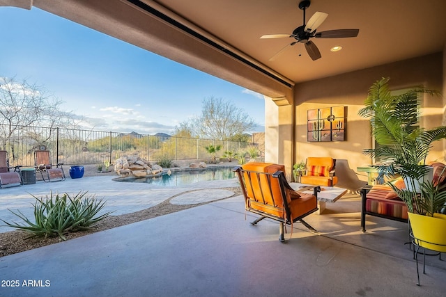 view of patio with a fenced backyard, a ceiling fan, and a fenced in pool