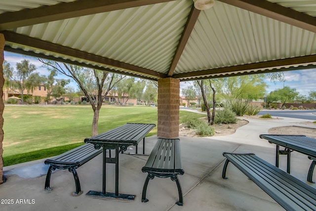 view of property's community with a lawn