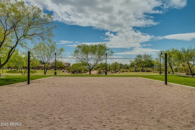 surrounding community featuring volleyball court and a yard