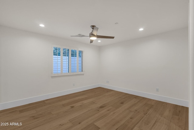 spare room with ceiling fan and light hardwood / wood-style flooring